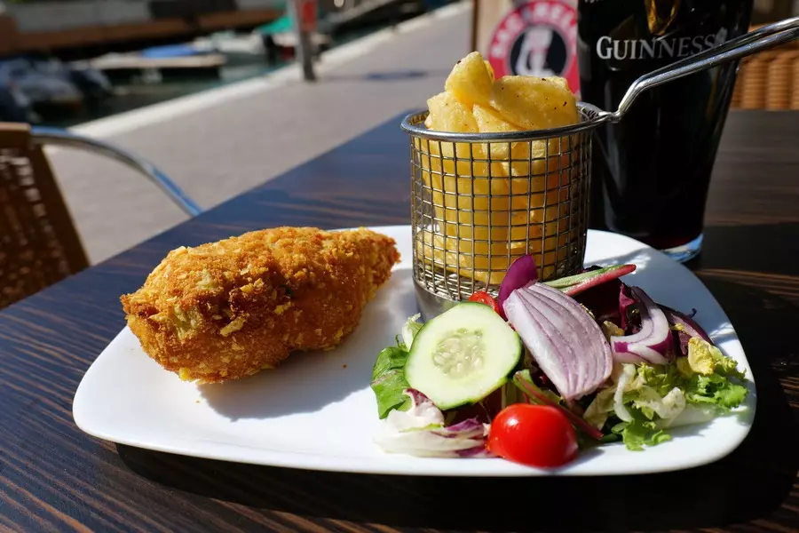 The Hendrix homemade chicken kiev with homemade chips and salad