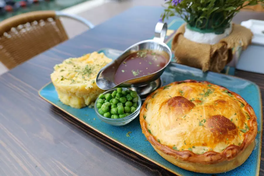 The Hendrix homemade pie with mashed potato, gravy and garden peas