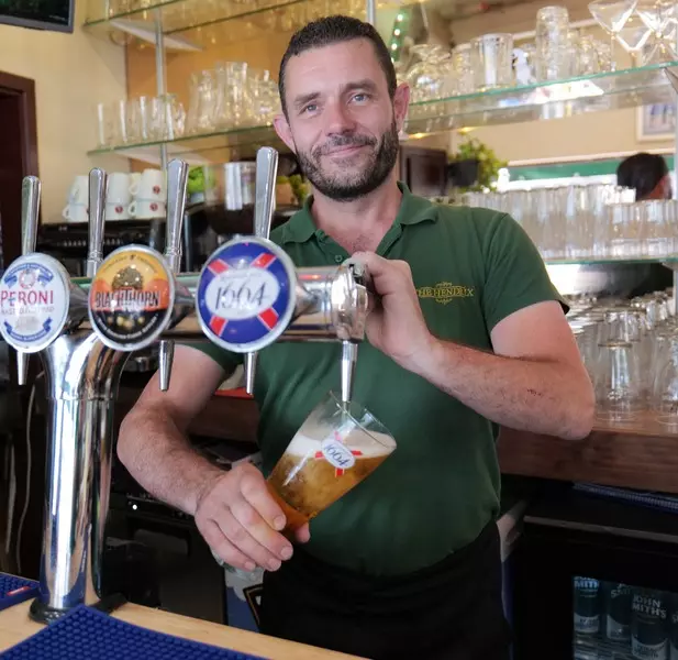 Our bartender Lee pouring a pint of Kronenburg
