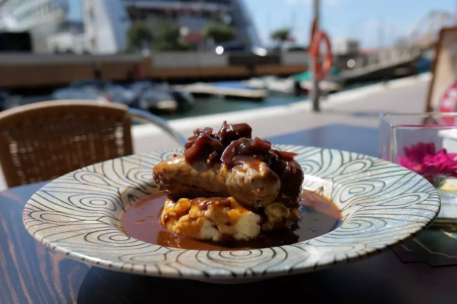 Sausage and mashed potato with onion gravy